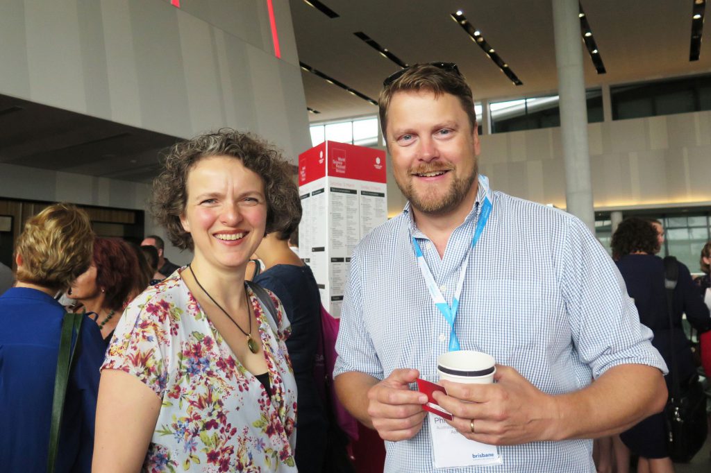 Two people at a ACSA conference posing for the camera